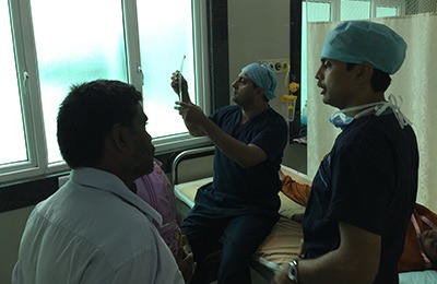 Dr Hosalkar examining patients with Dr Rajkumar at Ganga Hospital, Coimbatore.