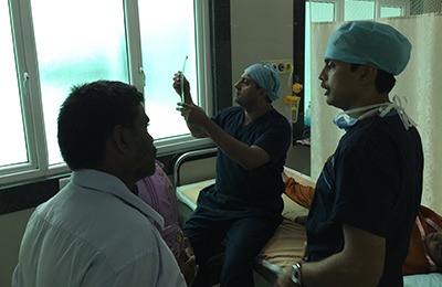 Dr Hosalkar examining patients with Dr Rajkumar at Ganga Hospital, Coimbatore.