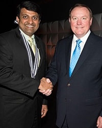 Dr Harish Hosalkar being congratulated by Dr David Teuscher,