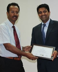 Dr Hosalkar- AO- Visiting Professor, receiving the Visiting Professorship Certificate from Prof Rajasekharan at Ganga Hospital